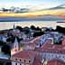 Aerial view of Zadar city with rooftops and the sea during sunset. - Olive Oil Times