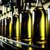 Bottles of olive oil in a factory assembly line