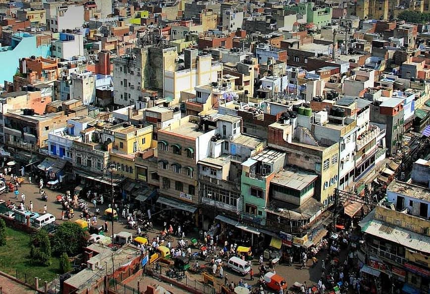 Aerial view of a densely populated urban area with various buildings and streets visible. - Olive Oil Times