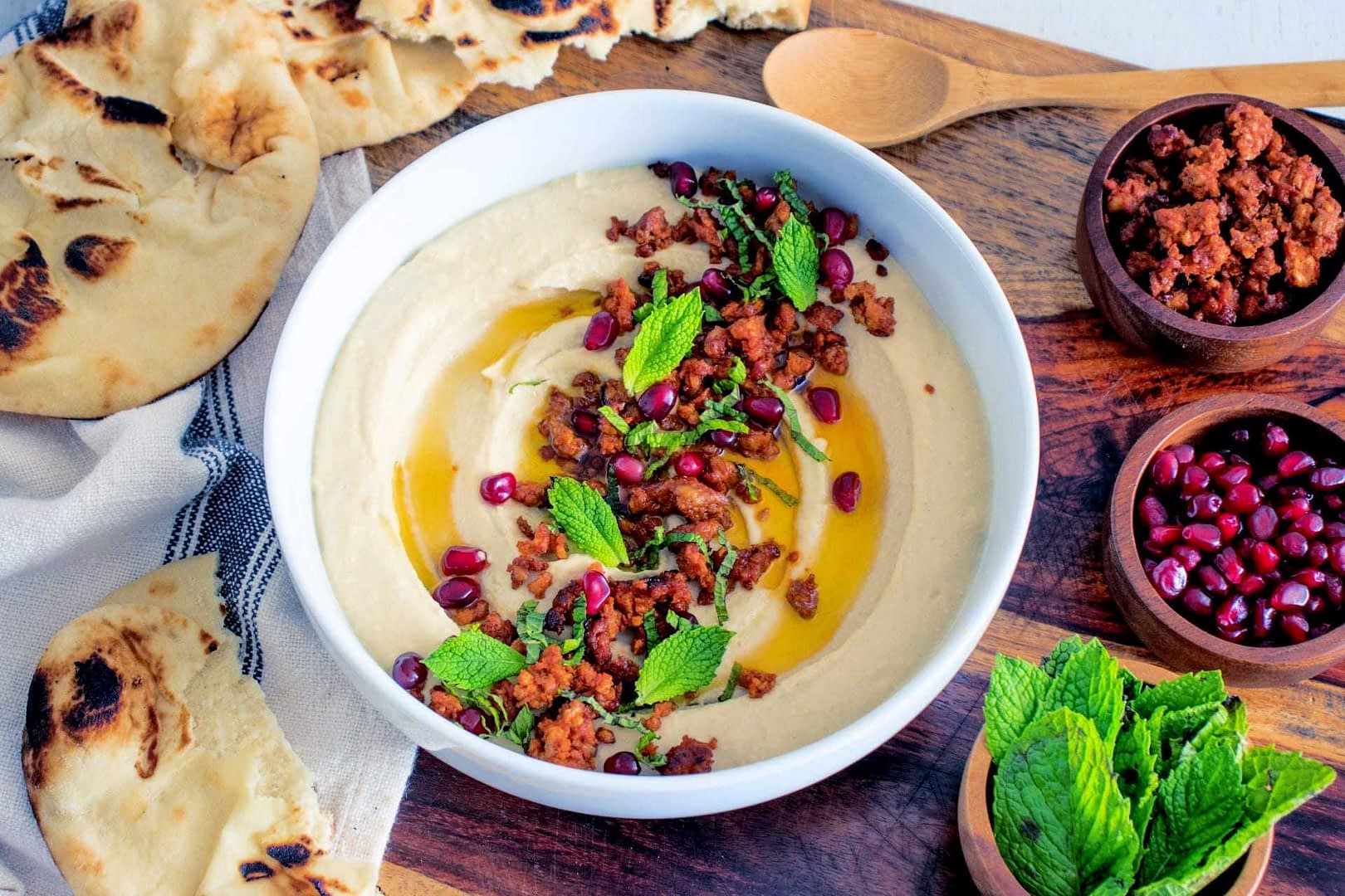 Olive Oil Hummus with Lamb Sausage, Mint & Pomegranate