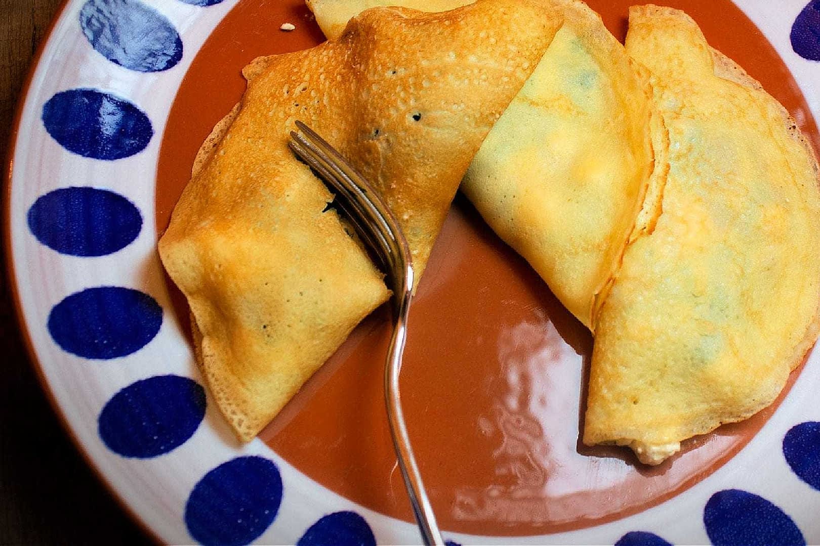 Savory Olive Oil Crepes with Caramelized Onions, Spinach, and Feta