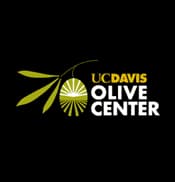 Logo of the UC Davis Olive Center featuring an olive and text in green and yellow. - Olive Oil Times