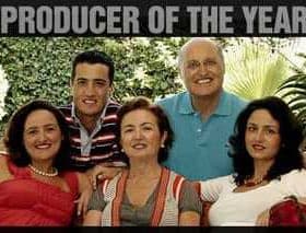 Group of five individuals posing for a family portrait with 'Producer of the Year 2010' text above them. - Olive Oil Times