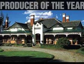 Historic Boundary Bend estate building with a large porch and multiple chimneys. - Olive Oil Times