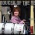 Deborah Rogers sitting on a forklift, labeled '2010 Producer of the Year'. - Olive Oil Times