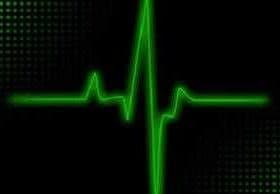 Green heartbeat line displayed on a black background with a dotted pattern. - Olive Oil Times