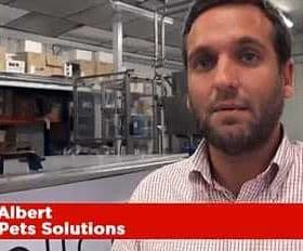 Paco Albert speaking in front of a production area at Pet Solutions. - Olive Oil Times