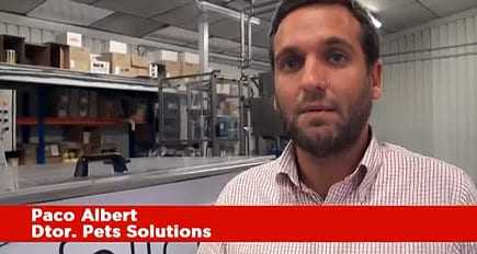 Paco Albert speaking in front of a production area at Pet Solutions. - Olive Oil Times