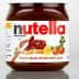 Jar of Nutella hazelnut spread with a label indicating ingredients and brand. - Olive Oil Times