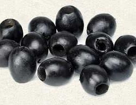 A group of black olives arranged on a light background, showcasing their oval shape and dark color. - Olive Oil Times