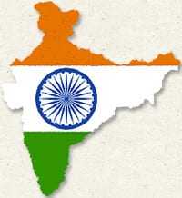 Outline of India filled with the colors of the national flag: orange, white, and green with a blue Ashoka Chakra. - Olive Oil Times
