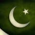 Flag of Pakistan featuring a white crescent moon and a five-pointed star on a green background. - Olive Oil Times