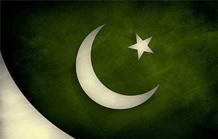 Flag of Pakistan featuring a white crescent moon and a five-pointed star on a green background. - Olive Oil Times