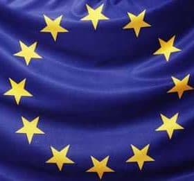 Flag of the European Union featuring a blue background with a circle of twelve yellow stars. - Olive Oil Times