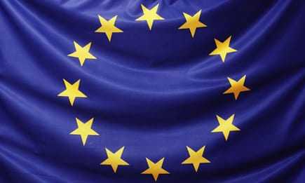 Flag of the European Union featuring a blue background with a circle of twelve yellow stars. - Olive Oil Times