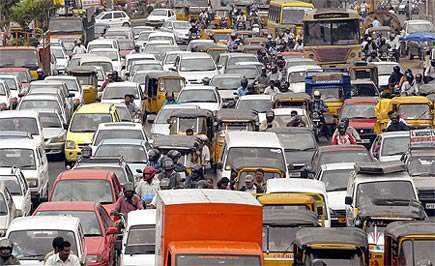 A congested urban road filled with various vehicles in a traffic jam. - Olive Oil Times