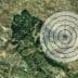 Satellite view of a landscape with a circular target overlay in the center. - Olive Oil Times