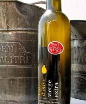 Bottle of extra virgin olive oil labeled 'huile d'olive vierge extra' from Ollioules, France. - Olive Oil Times
