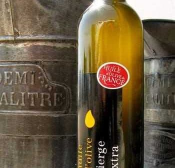 Bottle of extra virgin olive oil labeled 'huile d'olive vierge extra' from Ollioules, France. - Olive Oil Times