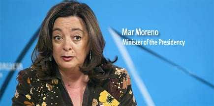 Mar Moreno speaking at a press conference, wearing a floral patterned blouse. - Olive Oil Times