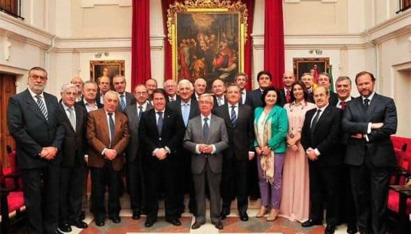 A group of individuals in formal attire posing for a photograph in an indoor setting. - Olive Oil Times
