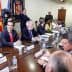 A group of government officials seated around a conference table during a meeting. - Olive Oil Times