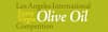 Logo for the Los Angeles International Extra Virgin Olive Oil Competition featuring text on a green background. - Olive Oil Times