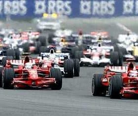 Several Formula 1 race cars competing on a track during a race event. - Olive Oil Times