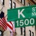 Green street sign for K Street NW with the number 1500 in Washington D.C. - Olive Oil Times