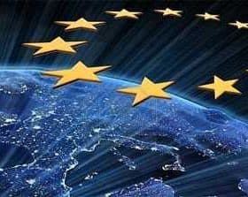 Graphic representation of the European Union stars above a view of Earth at night. - Olive Oil Times