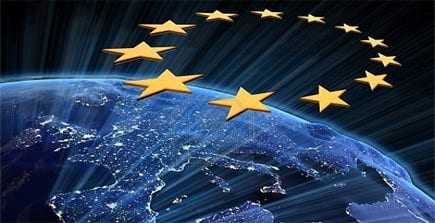 Graphic representation of the European Union stars above a view of Earth at night. - Olive Oil Times