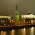 Night view of the Moscow Kremlin with illuminated towers and buildings along the river. - Olive Oil Times