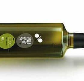 A green glass bottle of extra virgin olive oil with a label and a black cap. - Olive Oil Times
