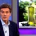 Dr. Oz speaking with olive oil bottles displayed in the background during a television segment. - Olive Oil Times