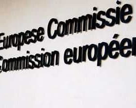 Sign displaying the name 'European Commission' in multiple languages with the EU flag. - Olive Oil Times