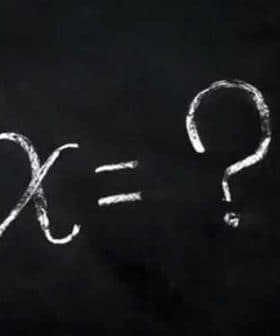 Chalkboard with the equation 'x = ?' written in white chalk. - Olive Oil Times