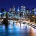 Night view of the Brooklyn Bridge with the Manhattan skyline illuminated in the background. - Olive Oil Times