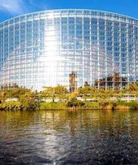 Modern glass structure of the European Parliament building located in Strasbourg, France, reflecting sunlight. - Olive Oil Times
