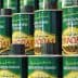 Row of green cans of Kyklopas extra virgin olive oil with yellow labels and Greek text. - Olive Oil Times