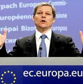 A man gesturing while speaking at a podium featuring the European Union logo. - Olive Oil Times