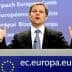 A man gesturing while speaking at a podium featuring the European Union logo. - Olive Oil Times