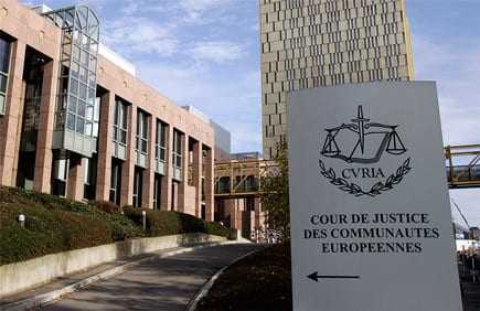 Exterior view of the Court of Justice of the European Communities building with a sign displaying 'CVRIA'. - Olive Oil Times