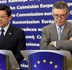 Two men standing at podiums during a press conference at the European Commission. - Olive Oil Times