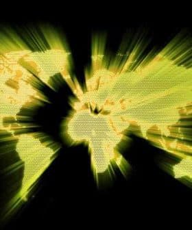 A world map displayed in yellow with radiating lines on a black background. - Olive Oil Times