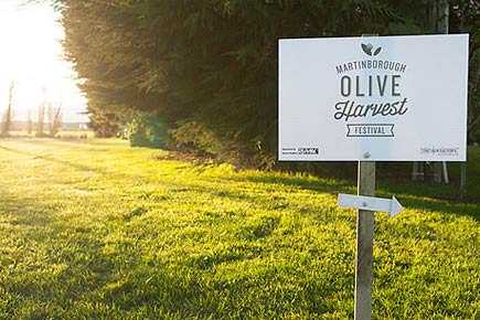 Sign for the Martinborough Olive Harvest Festival with an arrow pointing right. - Olive Oil Times
