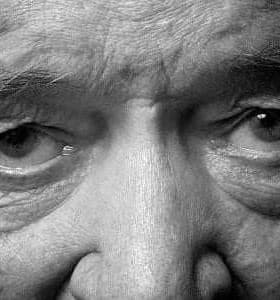 Close-up image of an elderly man's eyes with visible wrinkles and detailed features. - Olive Oil Times