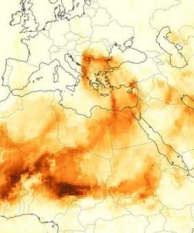 Map showing the distribution of red dust across Europe and North Africa with varying shades of orange. - Olive Oil Times