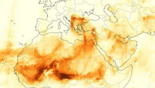 Map showing the distribution of red dust across Europe and North Africa with varying shades of orange. - Olive Oil Times