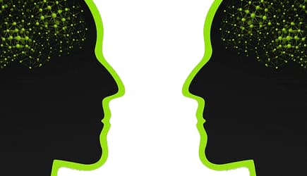 Two silhouetted faces in profile with abstract network patterns in the brain area. - Olive Oil Times