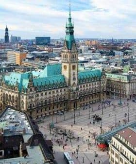 Aerial view of Hamburg City Hall with surrounding buildings and streets in the city. - Olive Oil Times